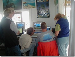 Clark Straw checking weather in Opua NZ for weather window to Figi with Suzy. Arianna and  Steve