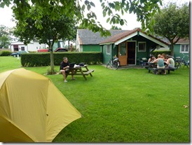 Small cabins for rent and table under apple tree