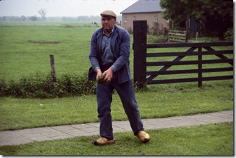 Dutch working in rain with wooden shoes